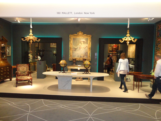 The stand of London fine furniture and works of art dealers Mallett at the European Fine Art Fair. Image Auction Central News.